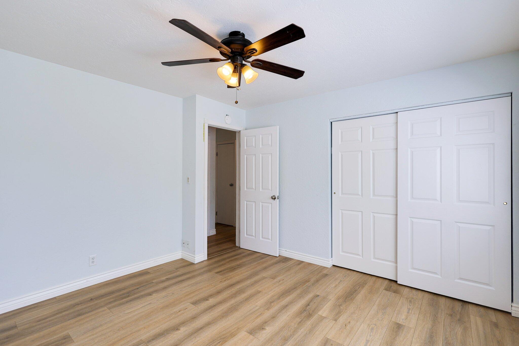 20727 Old Alturas Road Redding, CA 96003 - Photo 21 of 32 a view of an empty room with wooden floor