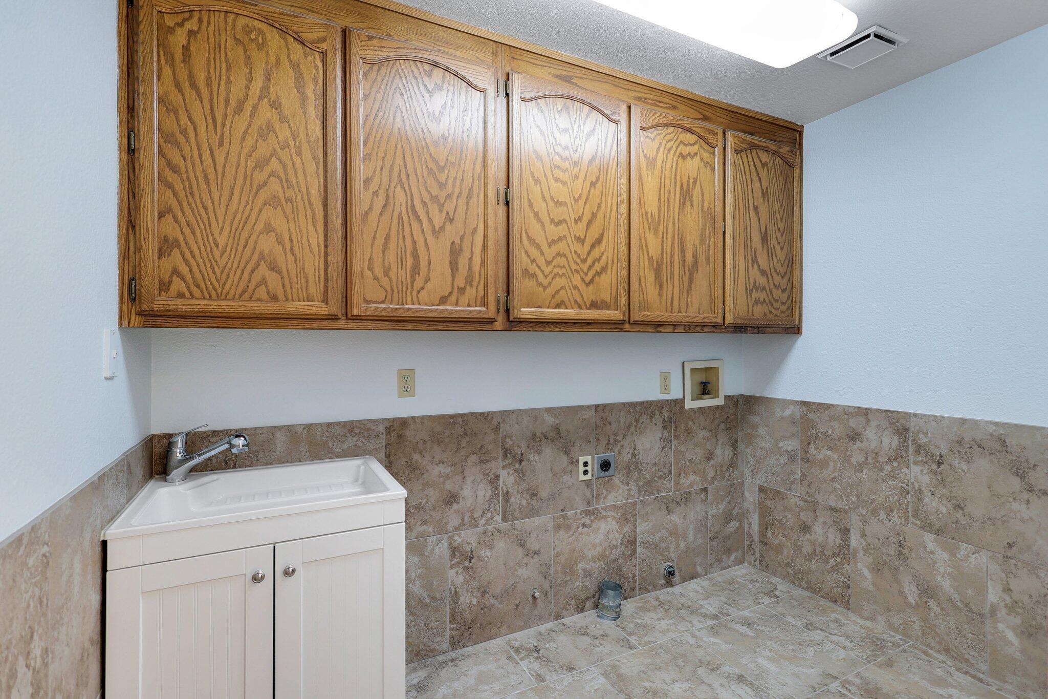 20727 Old Alturas Road Redding, CA 96003 - Photo 25 of 32 a bathroom with a sink and cabinets