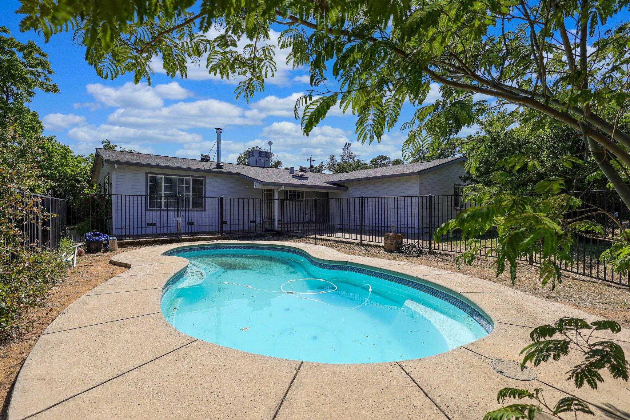 20727 Old Alturas Road Redding, CA 96003 - Photo 28 of 32 a view of a house with swimming pool and sitting area