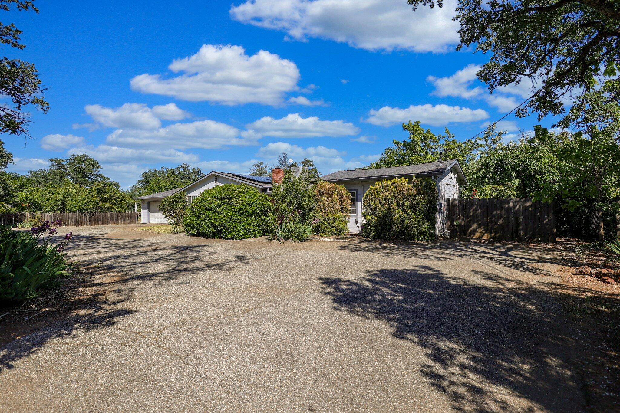 20727 Old Alturas Road Redding, CA 96003 - Photo 4 of 32 a view of a house with a street