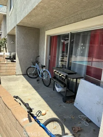 a room with gym equipment and glass door