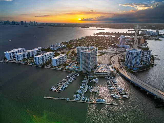 a view of a lake with tall buildings