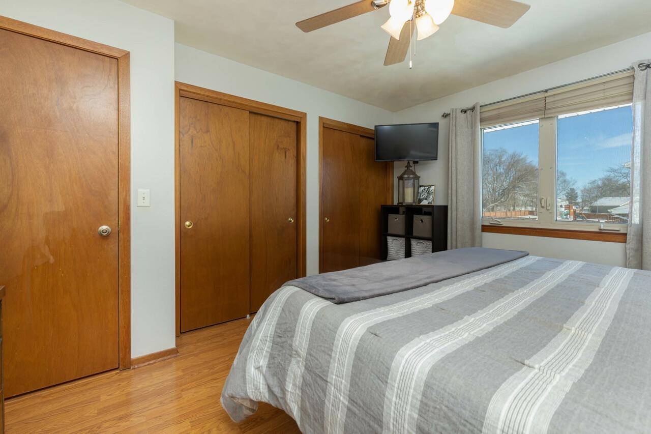 4126 Gloucester Road Roscoe, IL 61073 - Photo 18 of 28 a bedroom with a bed and a large window with the outer view