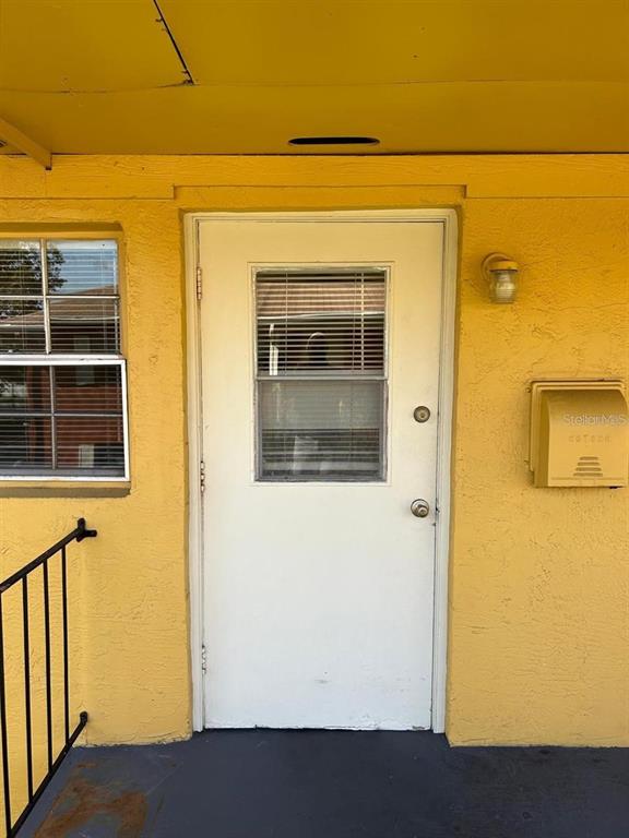 1627 West Oak Ridge Road, Unit D Orlando, FL 32809 - Photo 3 of 17 a view of front door of house