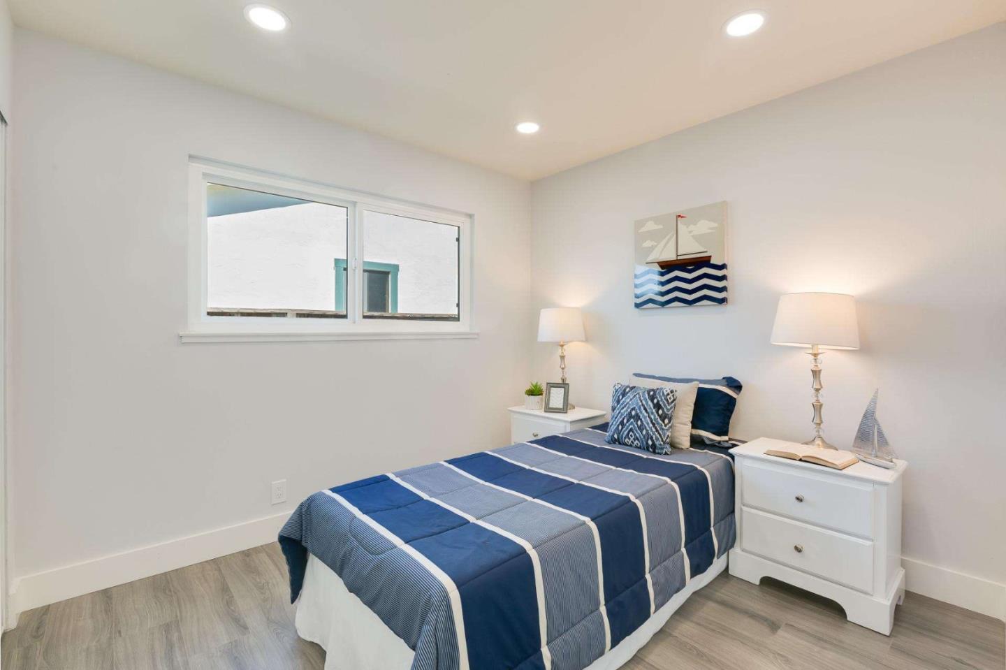 4258 Blue Ridge Street Fremont, CA 94536 - Photo 20 of 34 a bedroom with a bed and a night stand