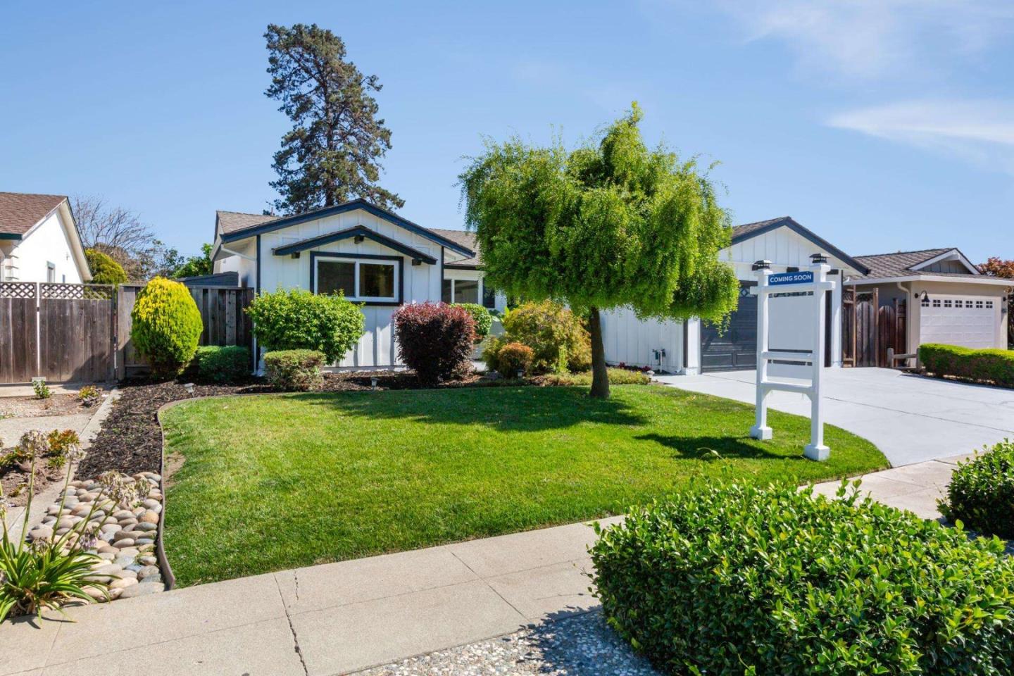 4258 Blue Ridge Street Fremont, CA 94536 - Photo 2 of 34 a front view of a house with a garden