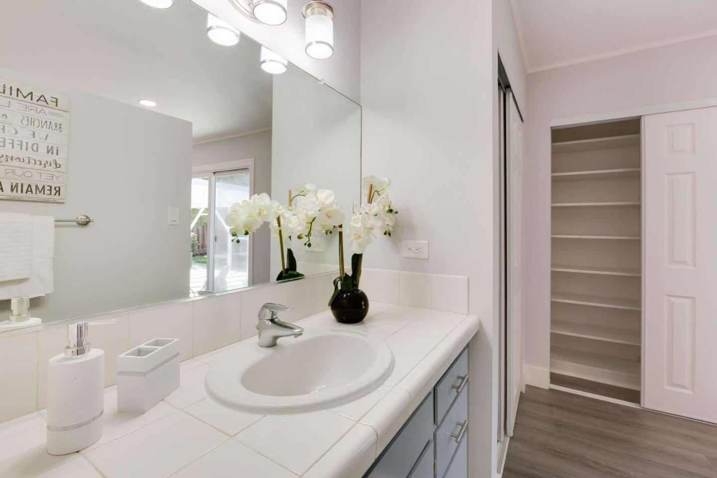 4258 Blue Ridge Street Fremont, CA 94536 - Photo 27 of 34 a bathroom with a double vanity sink and a mirror