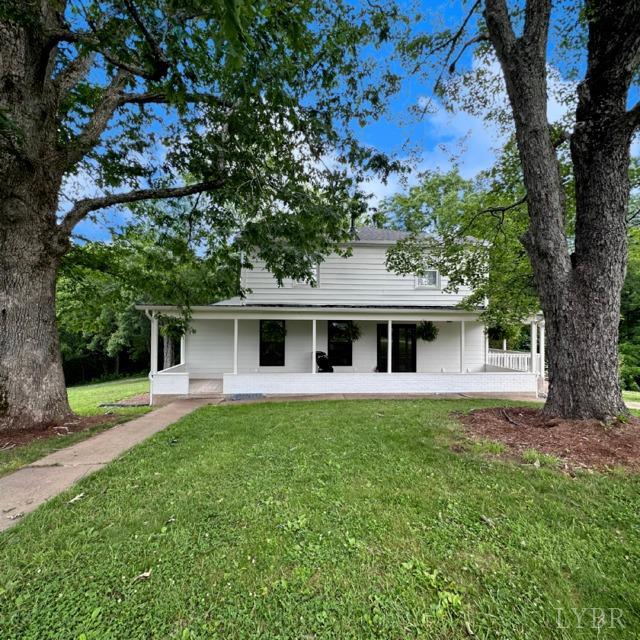 3638 Spring Grove Road Spout Spring, VA 24522 - Photo 2 of 9 a front view of a house with a yard