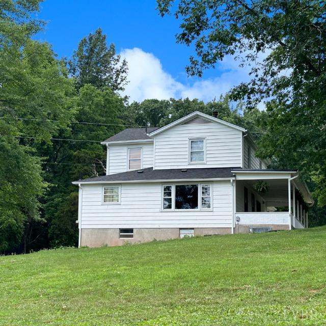 3638 Spring Grove Road Spout Spring, VA 24522 - Photo 3 of 9 a front view of a house with a garden