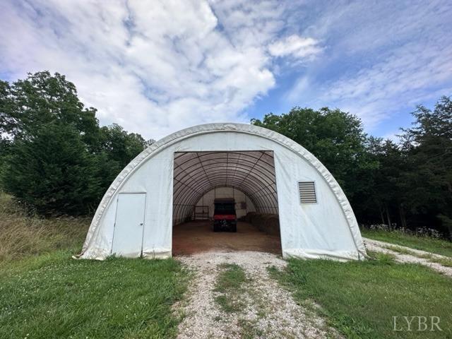 3638 Spring Grove Road Spout Spring, VA 24522 - Photo 6 of 9 a view of a grey house with a yard