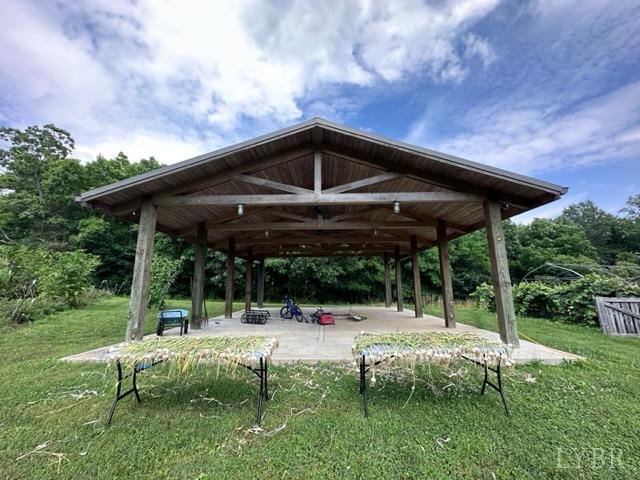 3638 Spring Grove Road Spout Spring, VA 24522 - Photo 7 of 9 a backyard of a house with yard and outdoor seating