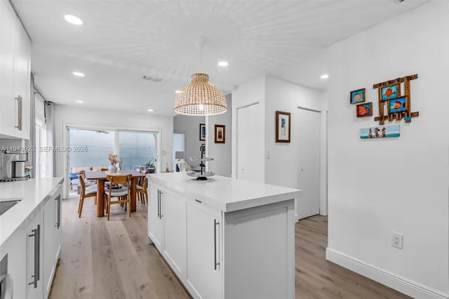 a view of a kitchen from the hallway