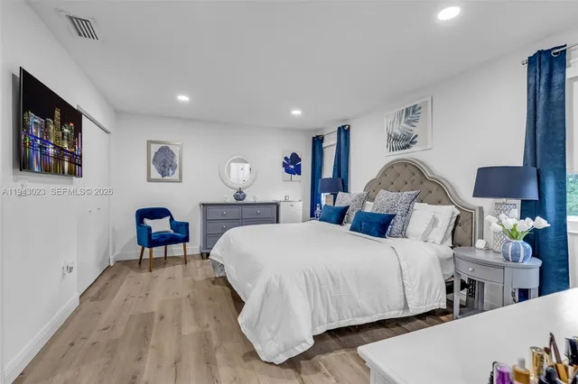 a bedroom with a bed and a table