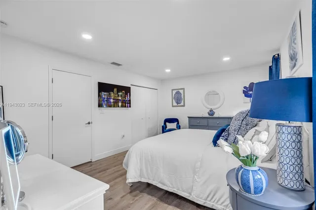 a bed room with furniture and a lamp