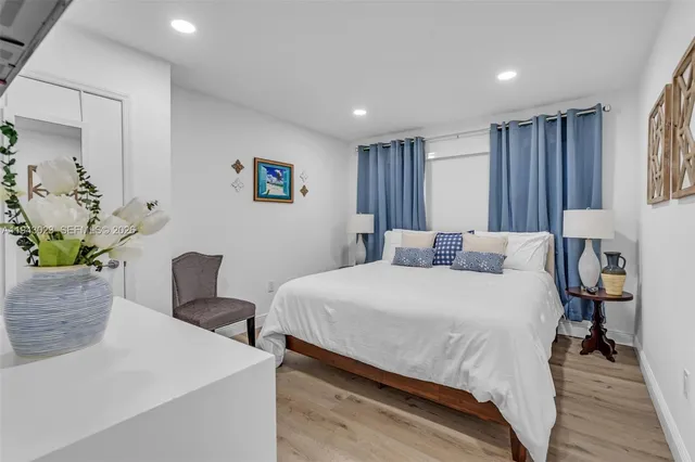 a bedroom with a bed and a table