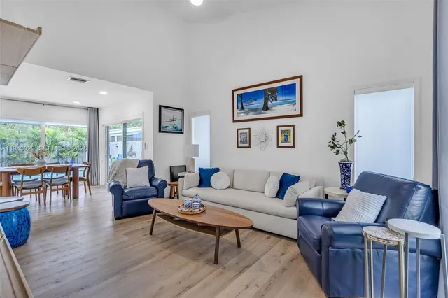 a living room with furniture and a table