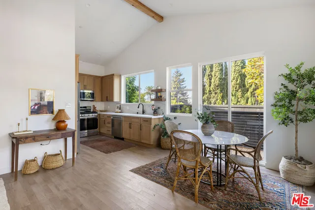 a view of a dining room with furniture window and outside view