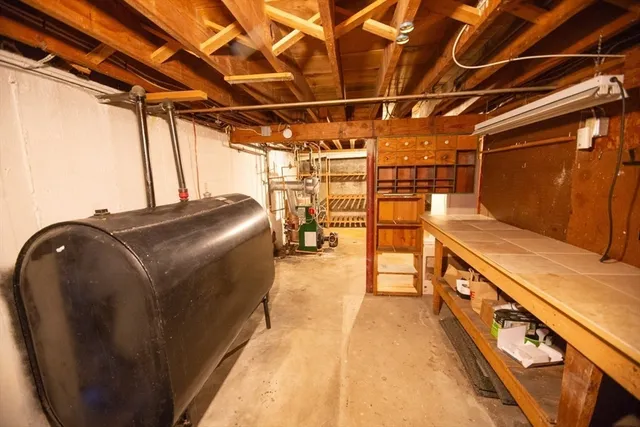 a view of a house with wooden deck and trees