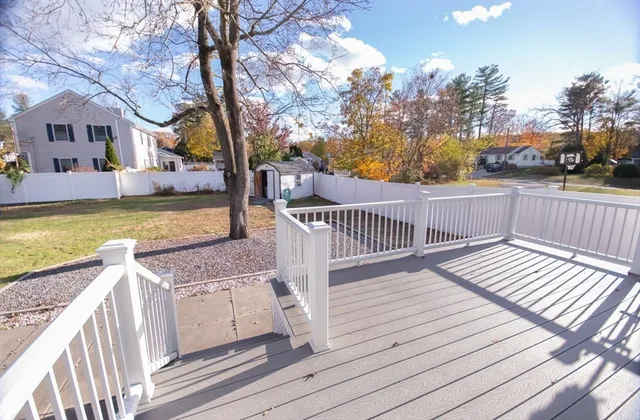 a view of a wooden deck with a patio
