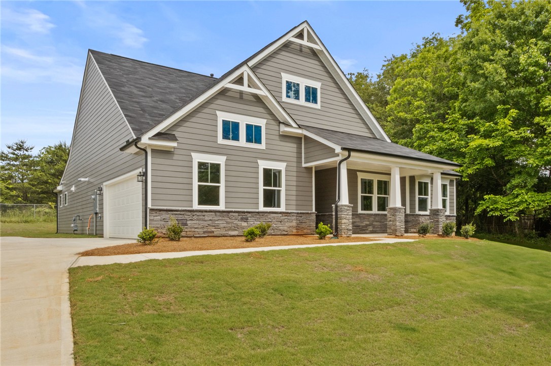 315 Old Shirley Road Central, SC 29630 - Photo 2 of 26 This newly constructed residence boasts an attached garage and an inviting porch.