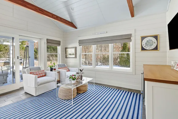 a living room with furniture and a window