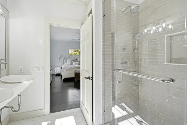 a en suite bathroom with a granite countertop shower