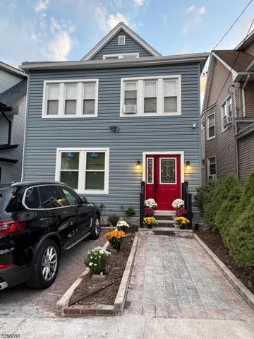 a view of a car parked in front of a house