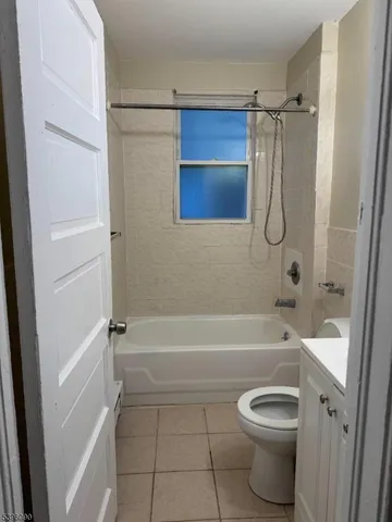 a bathroom with a shower a bathtub and a shower