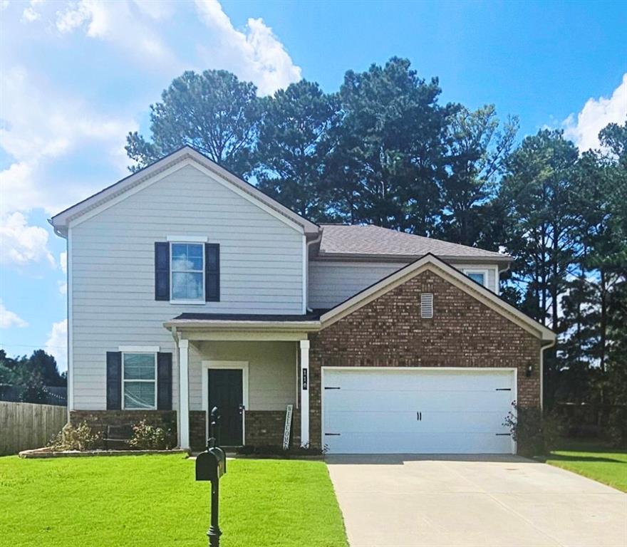 110 Halibut Circle Covington, GA 30016 - Photo 1 of 15 a view of a house with a yard