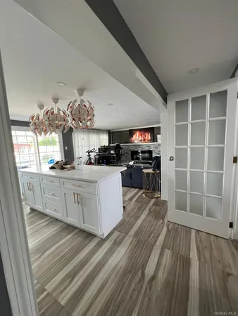 a kitchen with cabinets a sink and appliances