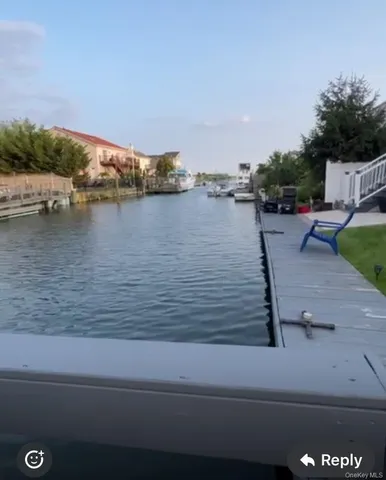 a view of a backyard with sitting area