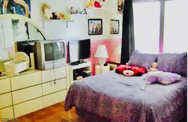 a bedroom with a bed and a cabinets
