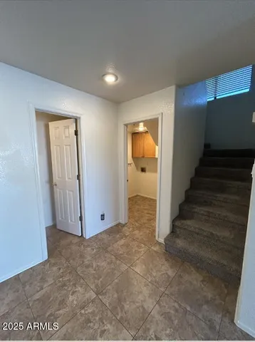 a view of an entryway with wooden floor