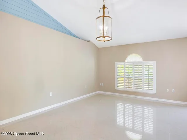 a view of empty room with windows