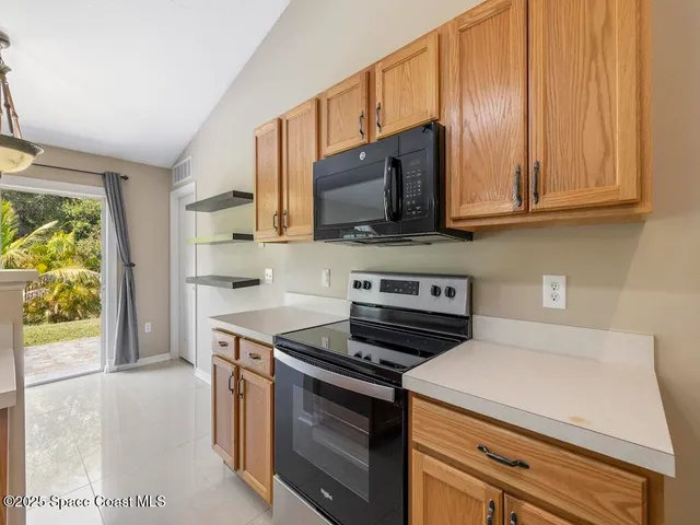 a kitchen with a stove and a microwave
