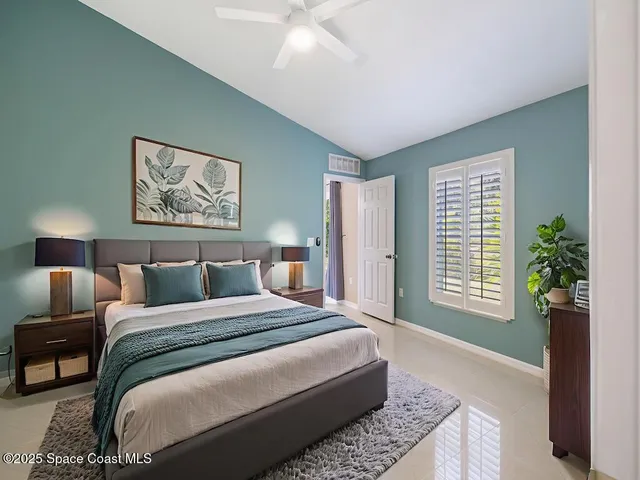 a bedroom with bed and a window