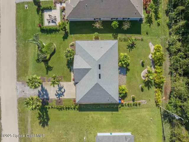 an aerial view of a house with a garden