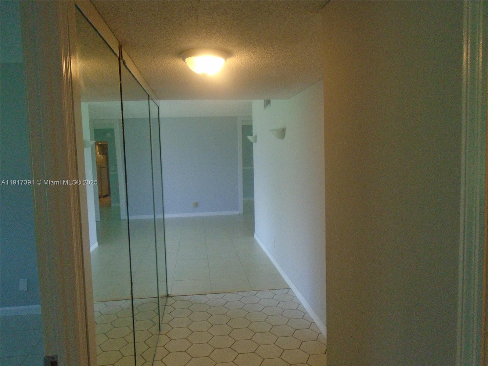 7051 Environ Boulevard, Unit 136 Lauderhill, FL 33319 - Photo 14 of 23 a bathroom with a shower and a glass door