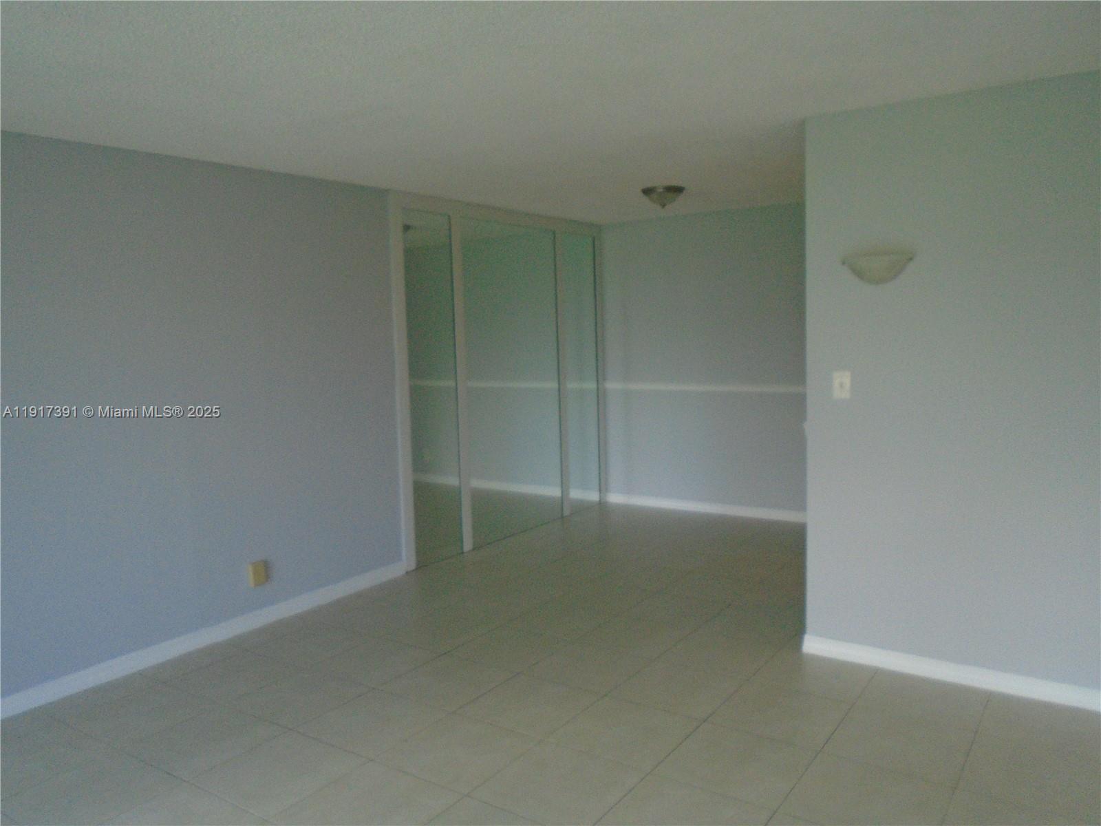 7051 Environ Boulevard, Unit 136 Lauderhill, FL 33319 - Photo 17 of 23 an empty room with a empty space