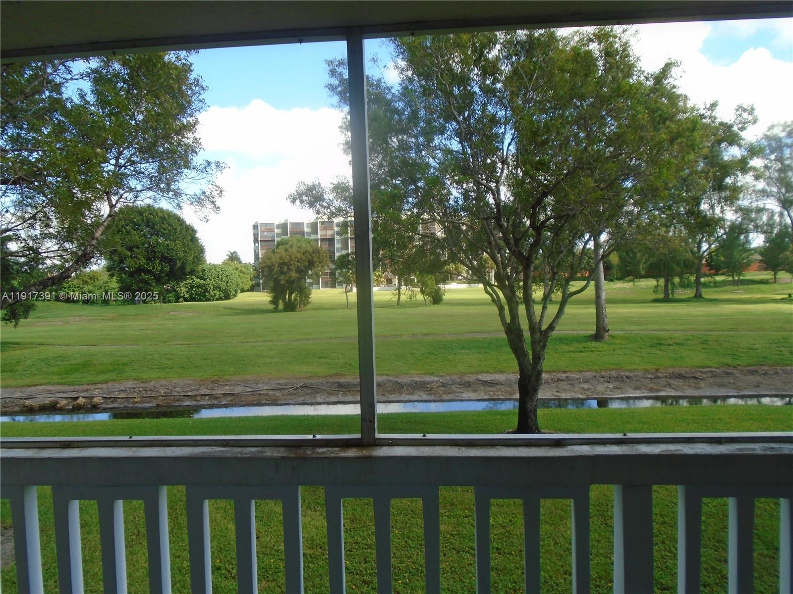 7051 Environ Boulevard, Unit 136 Lauderhill, FL 33319 - Photo 18 of 23 a view of outdoor space with deck and yard