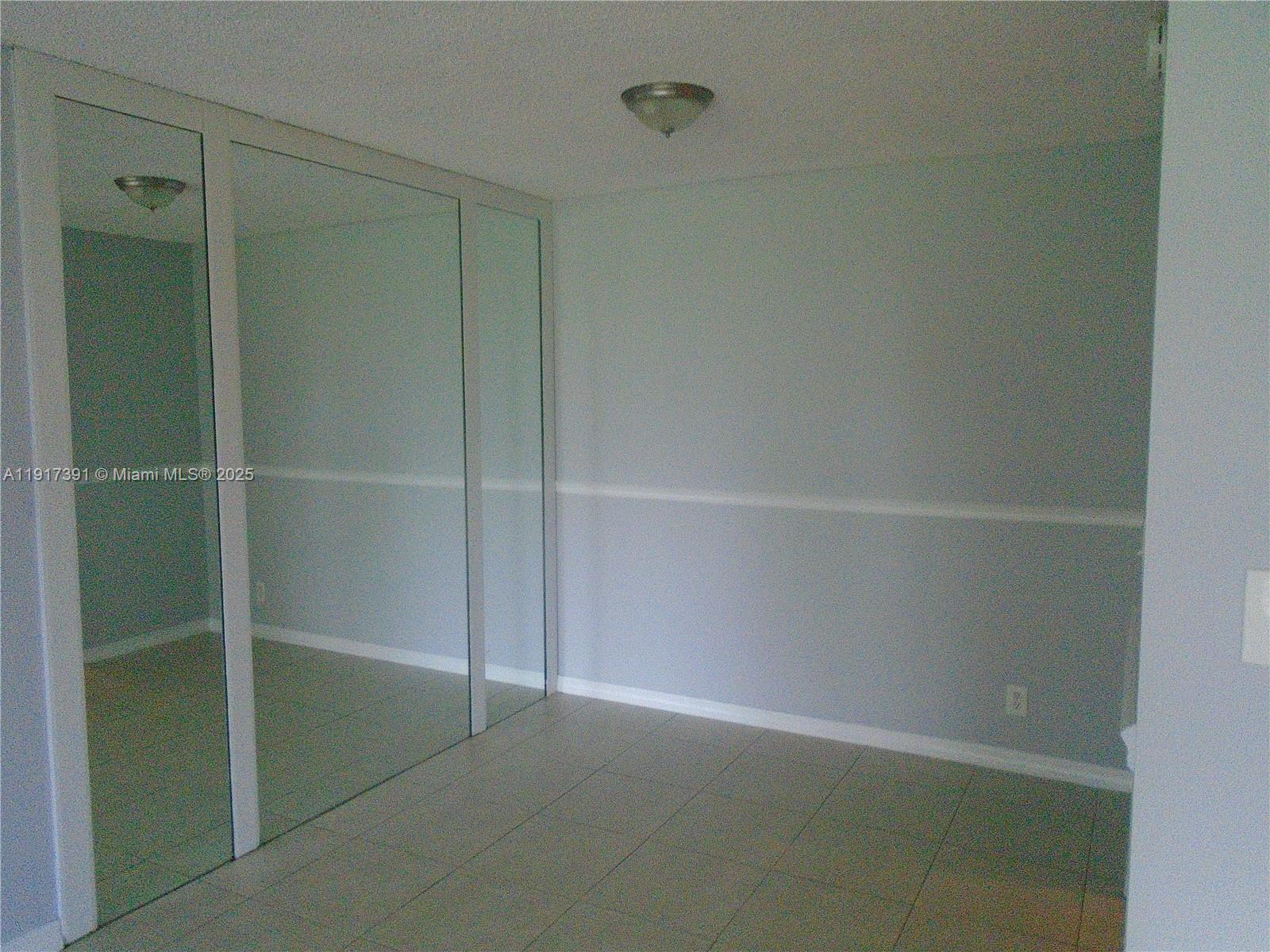 7051 Environ Boulevard, Unit 136 Lauderhill, FL 33319 - Photo 20 of 23 a view of an empty walk in closet
