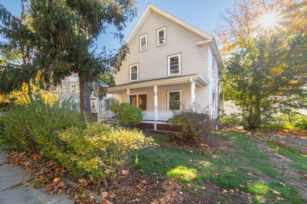166 Elliot Street, Unit 2 Newton, MA 02464 - Photo 18 of 20 a front view of house with yard and green space