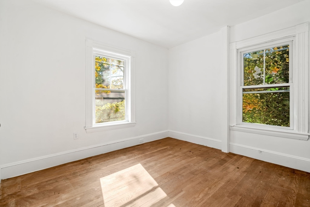 166 Elliot Street, Unit 2 Newton, MA 02464 - Photo 4 of 20 an empty room with a window