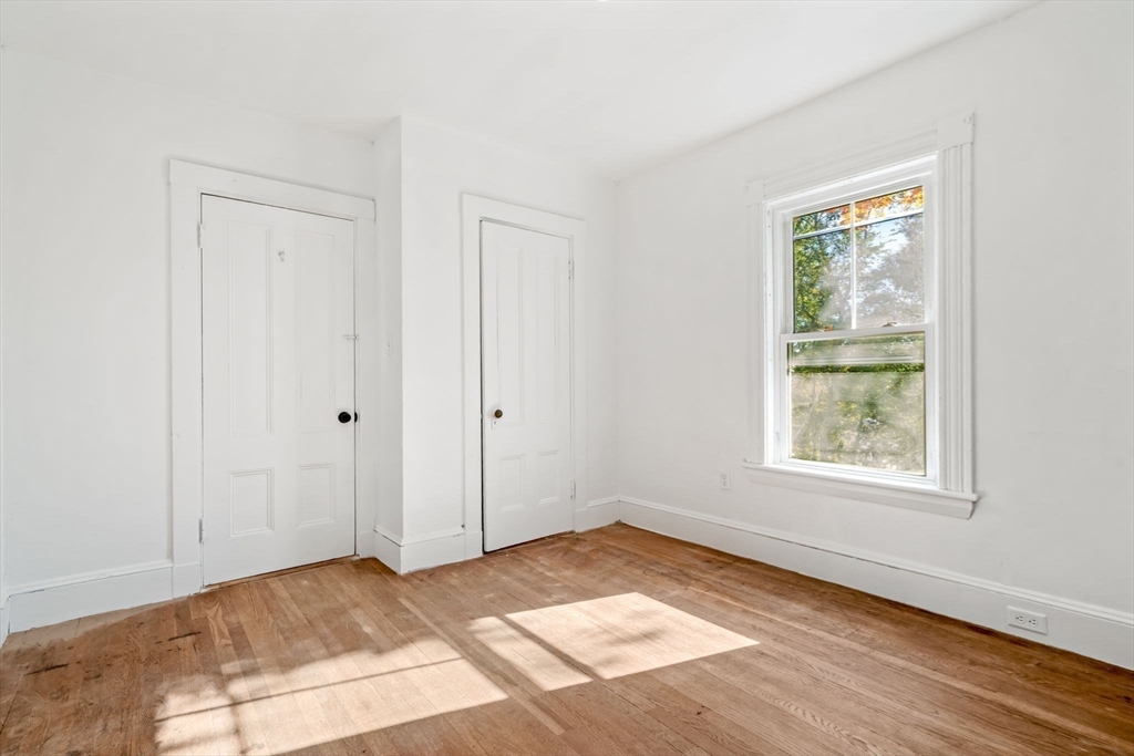 166 Elliot Street, Unit 2 Newton, MA 02464 - Photo 5 of 20 a view of an empty room and window