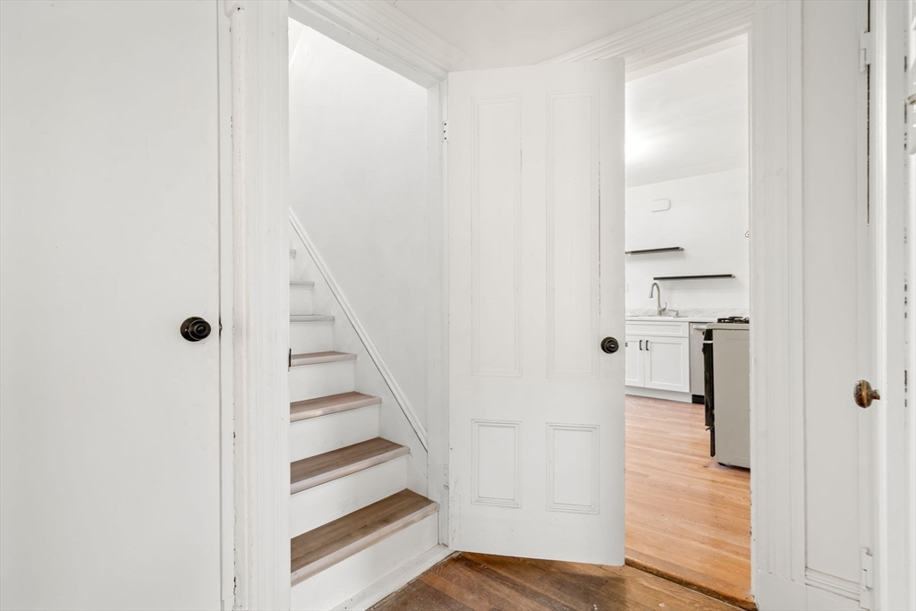 166 Elliot Street, Unit 2 Newton, MA 02464 - Photo 6 of 20 a view of a hallway with wooden floor and entryway
