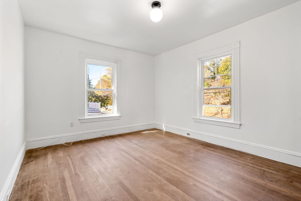 166 Elliot Street, Unit 2 Newton, MA 02464 - Photo 7 of 20 an empty room with a window