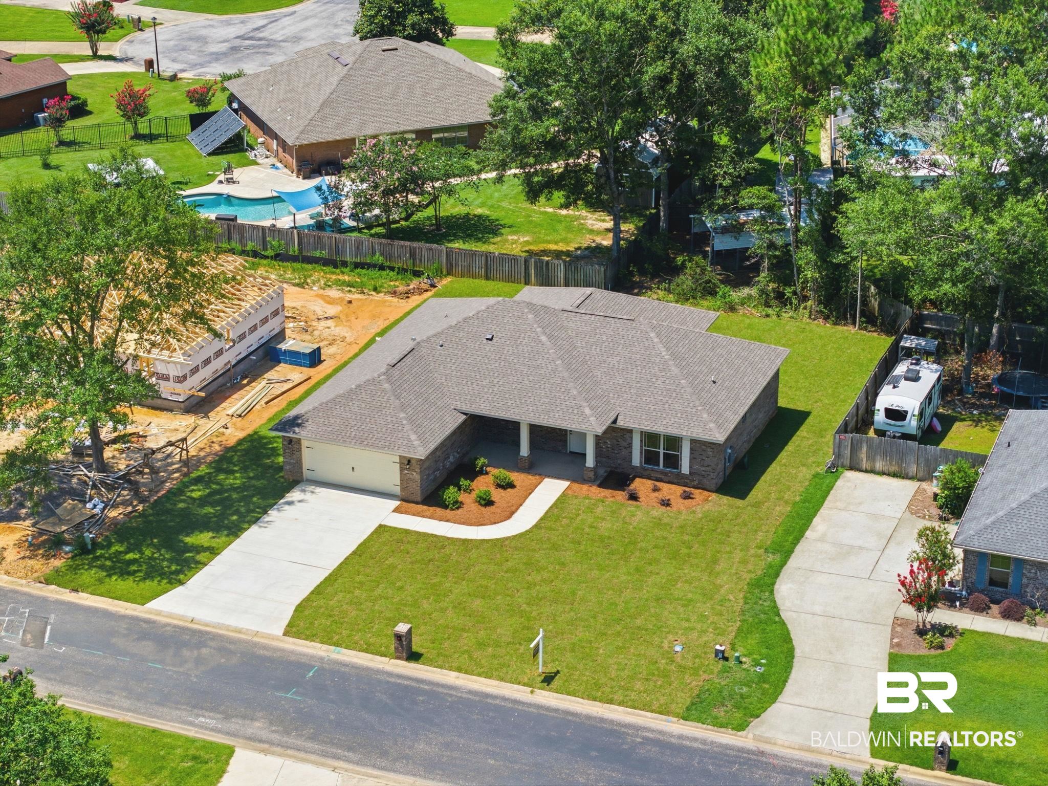 32656 Arbor Ridge Circle Lillian, AL 36549 - Photo 46 of 56 Brick exterior with white trim and a gabled roof