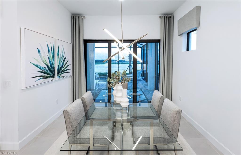20155 Napa Loop Estero, FL 33928 - Photo 13 of 35 a dining room with furniture and large windows