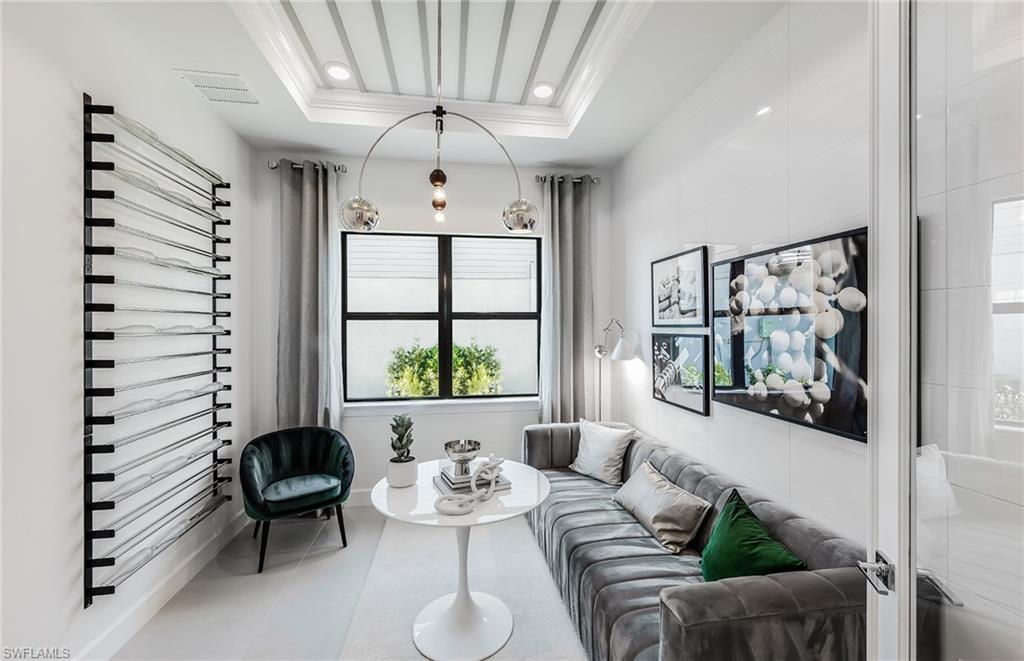 20155 Napa Loop Estero, FL 33928 - Photo 18 of 35 a living room with furniture and a large window