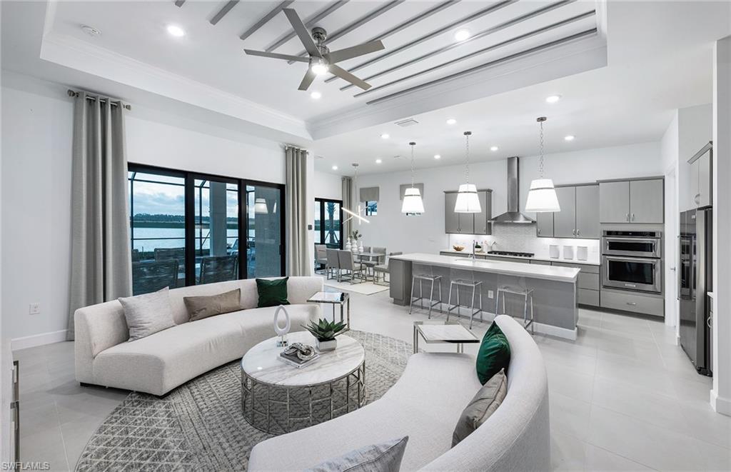 20155 Napa Loop Estero, FL 33928 - Photo 7 of 35 a living room with furniture kitchen view and a large window